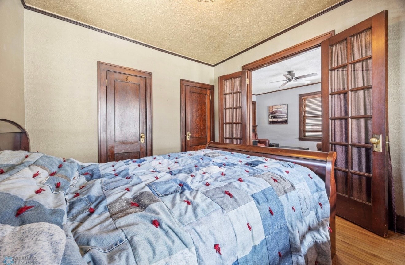 Bedroom — craftsman-style with original wood doors and French doors