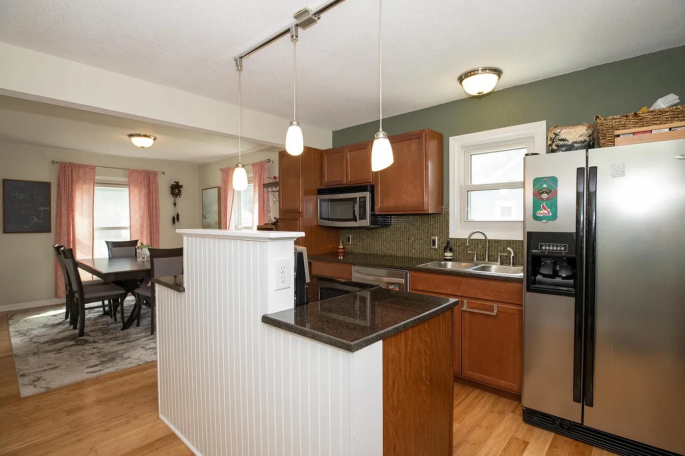 Kitchen — island open to dining area
