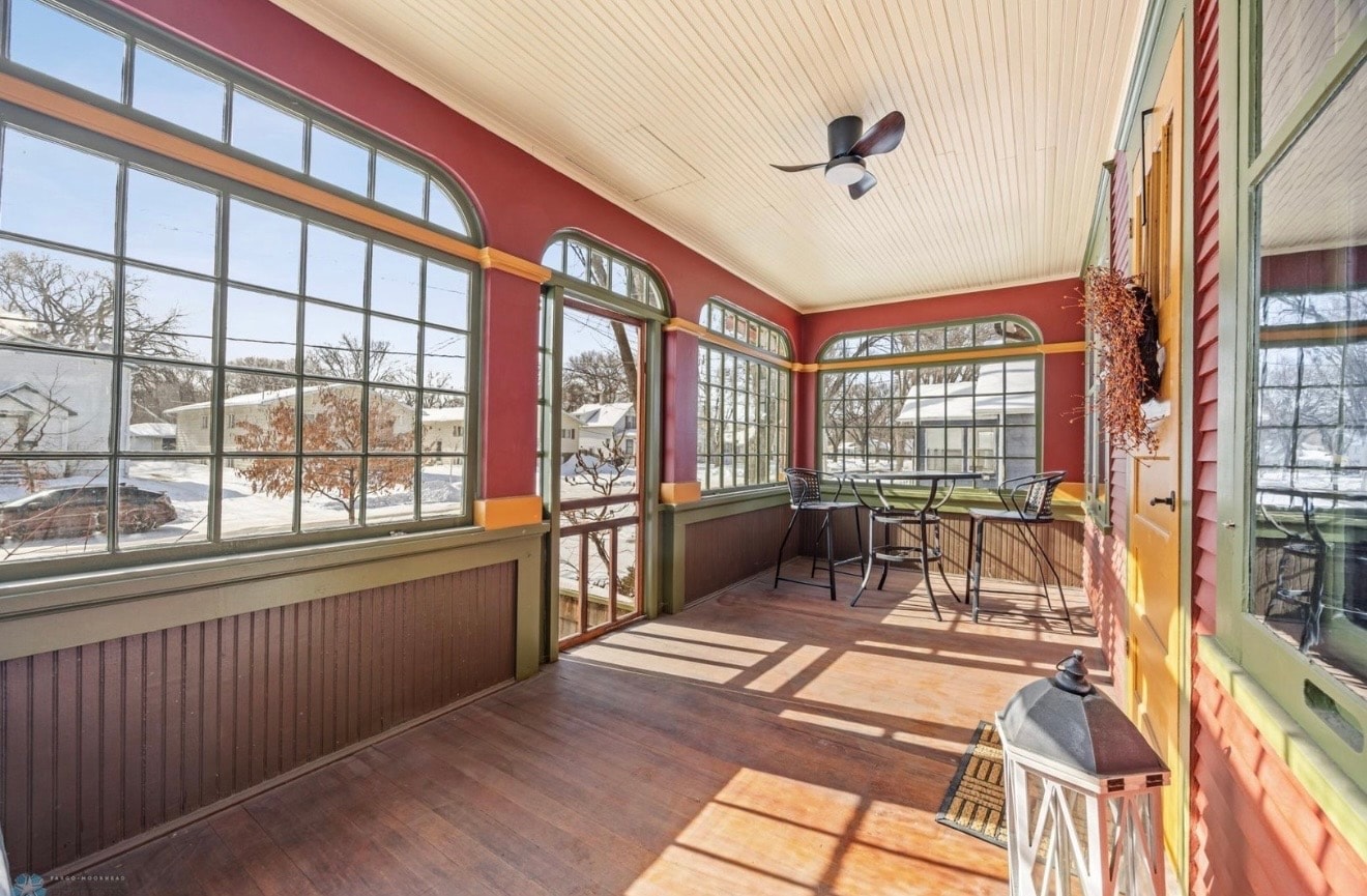 Warm, beautifully designed sunroom interior